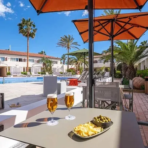 ESTIVAL: Corporate, terrace with beers and pool at hotel.