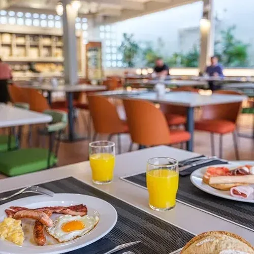 Continental breakfast at ESTIVAL: Corporate, with juice and toast.