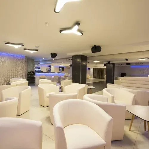 ESTIVAL: Corporate lounge, white seating and dance floor.