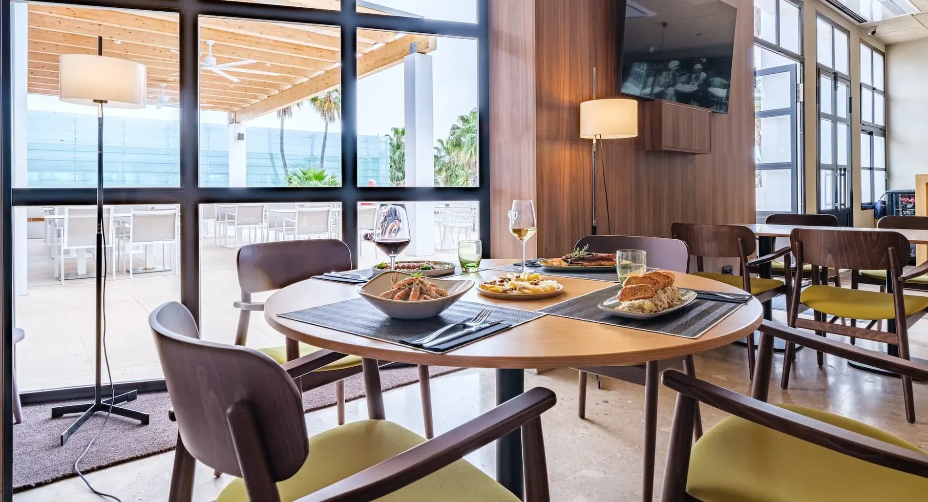Enjoy exquisite gastronomy at Estival Group Hotels' restaurant, featuring a modern ambiance.