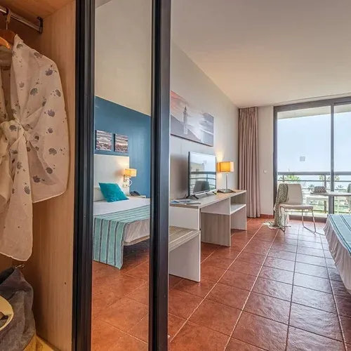 Estival Islantilla 4*: Spacious room with closet, balcony, and sea view.