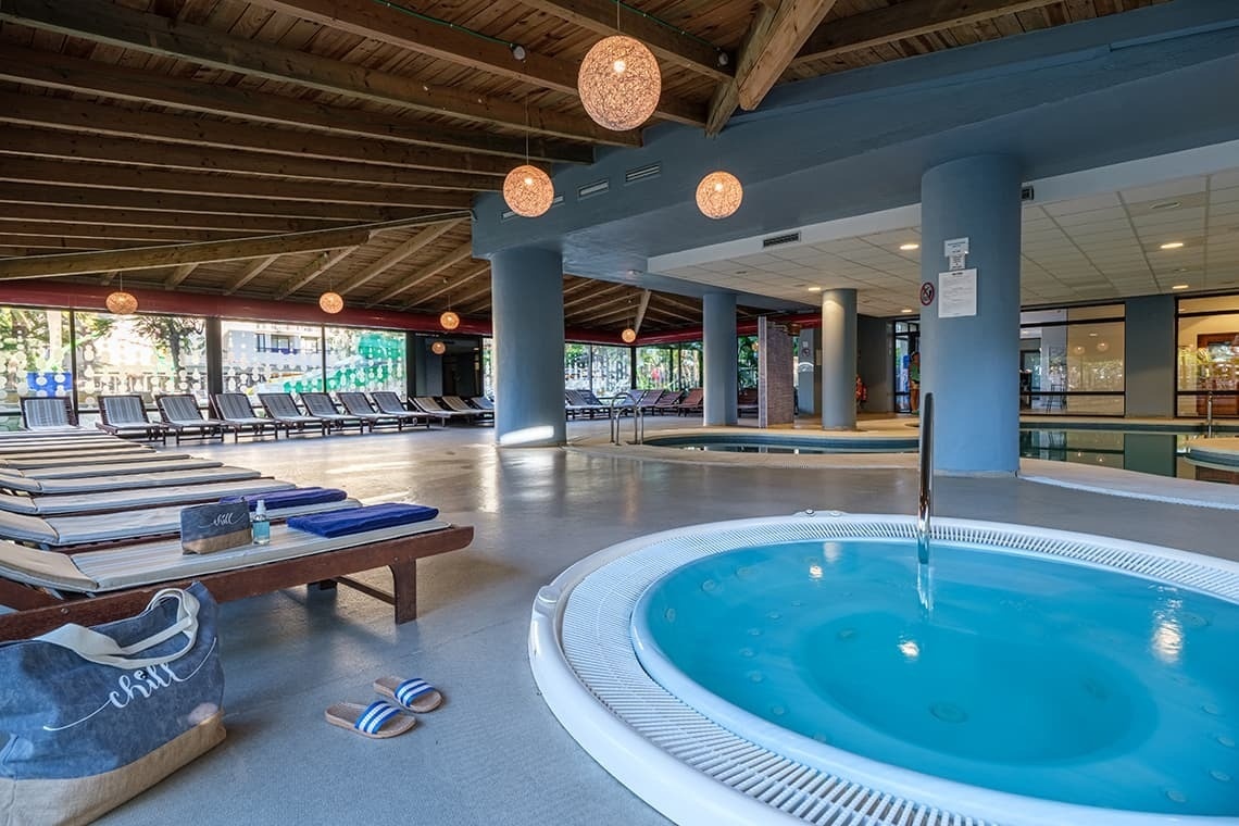 a bag with the word chill on it sits next to a jacuzzi