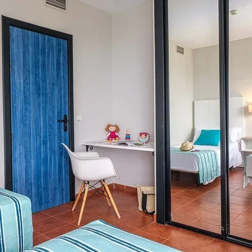 Estival Islantilla 4* | Twin beds, blue door, desk, mirror wardrobe