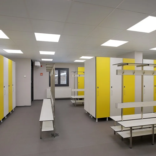 ESTIVAL Corporate changing rooms: yellow and white lockers, benches