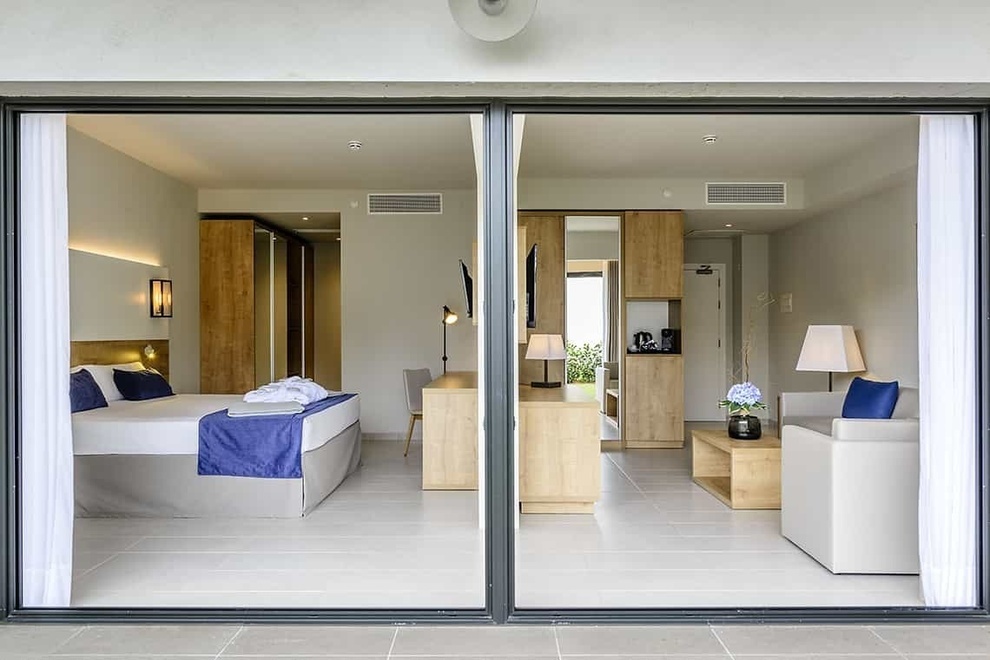 a hotel room with a bed and a couch