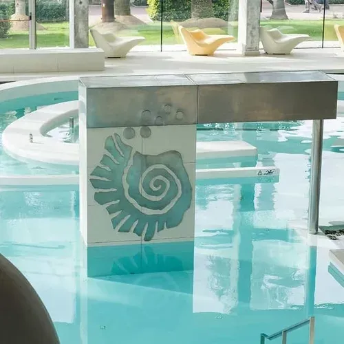 ESTIVAL: Corporate indoor pool with modern design and lounge chairs