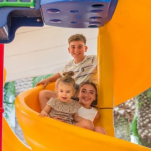 Happy kids on playground slide at Estival Park Almaris | Estival Group | Tarragona