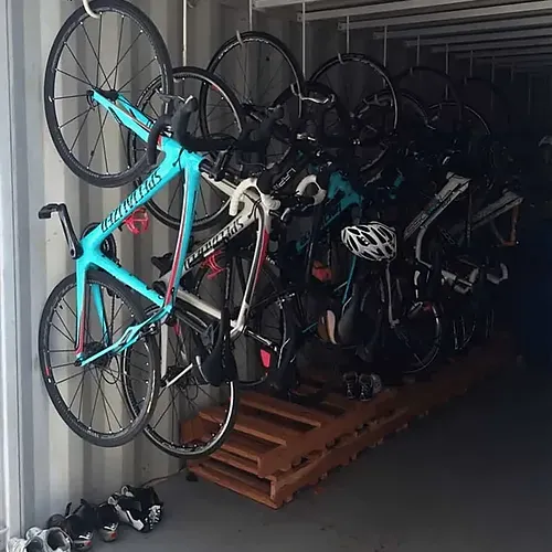 Bicycles organized on racks. ESTIVAL: Corporate cycling facility.