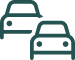 un par de coches están parados uno al lado del otro .