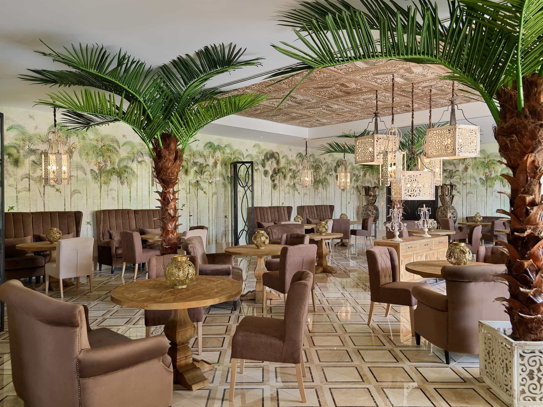 a restaurant with palm trees and tables and chairs