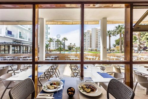 Dining terrace with pool view at San Fermín by Dorobe | Dorobe Hotels, Torremolinos.