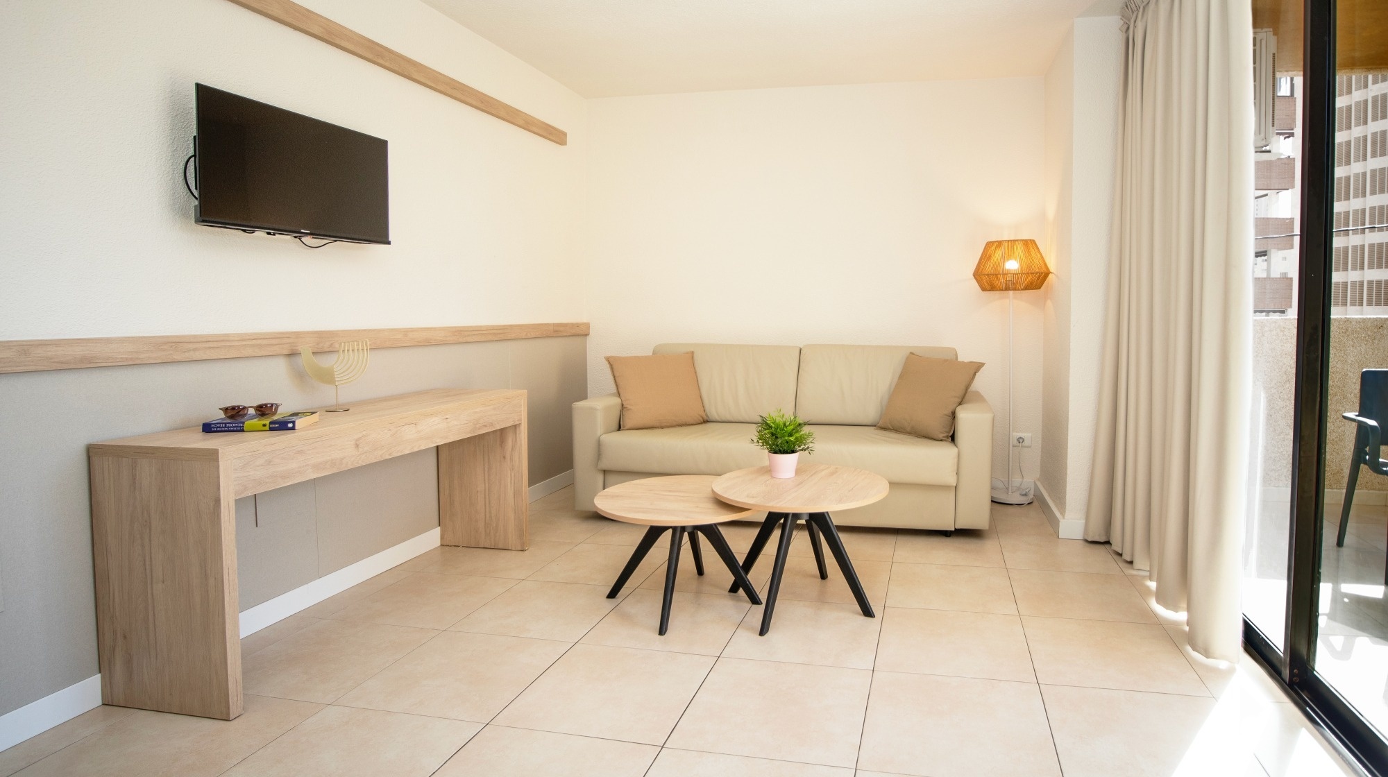 a living room with a couch and a flat screen tv