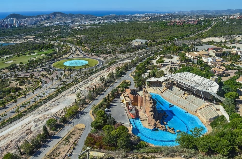 an aerial view of a large swimming pool in a park