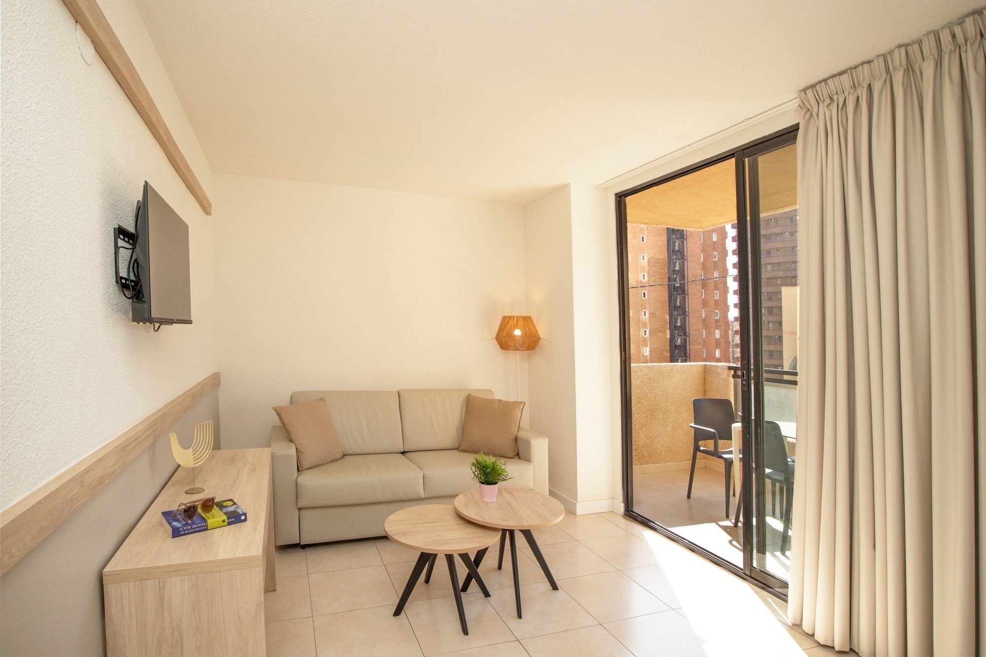 a living room with a couch and two tables