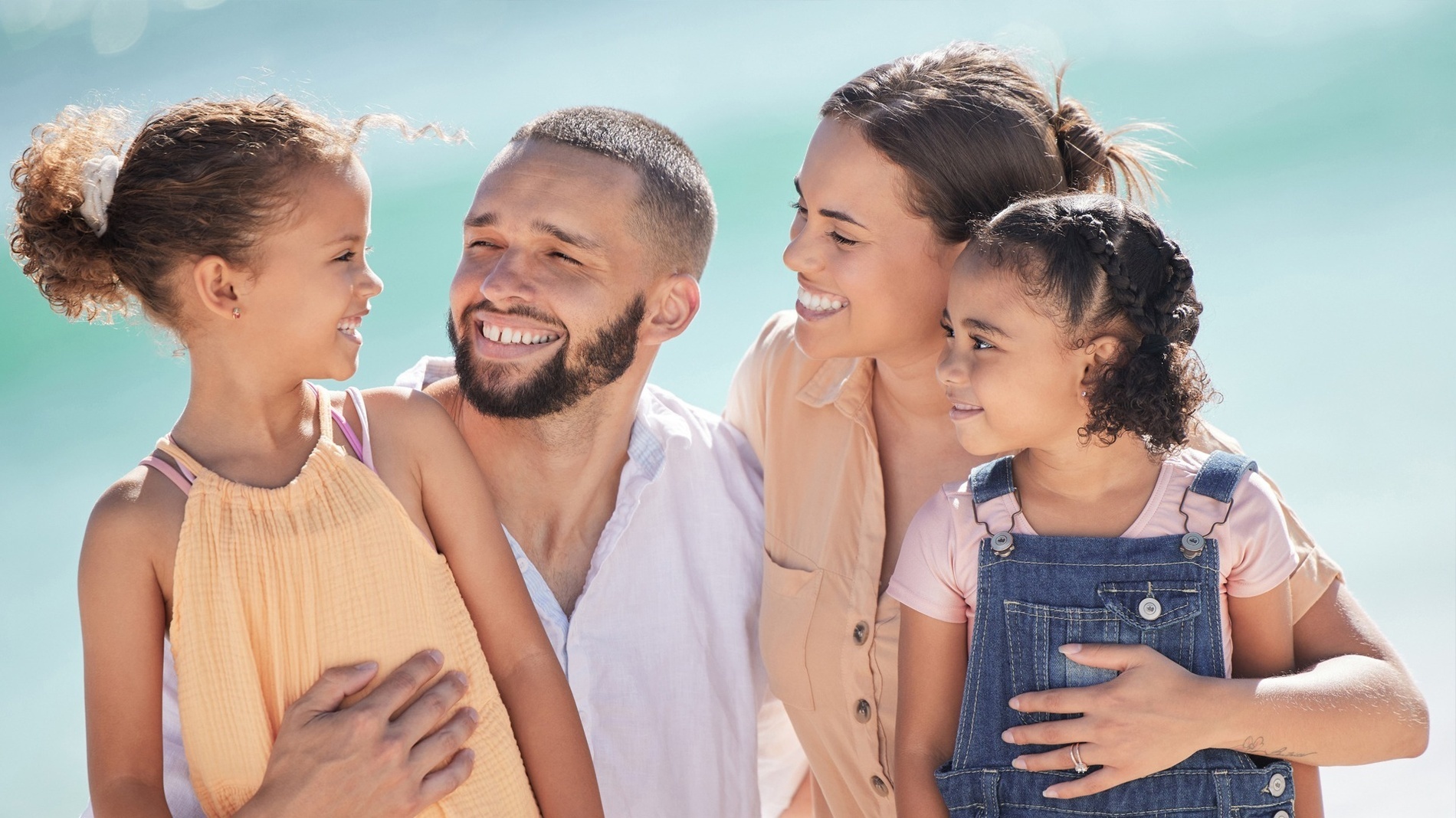 a group of people are standing in a circle and smiling