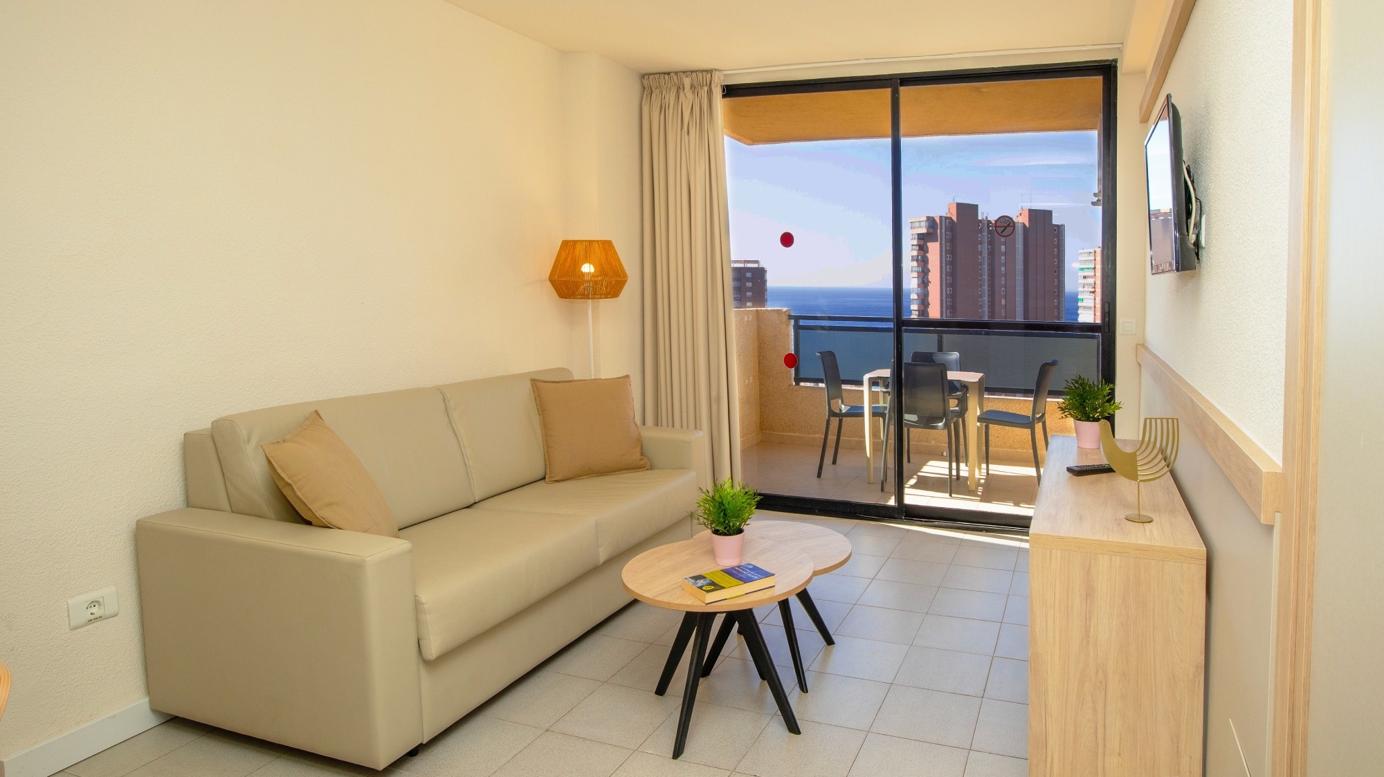 a living room with a couch and two tables