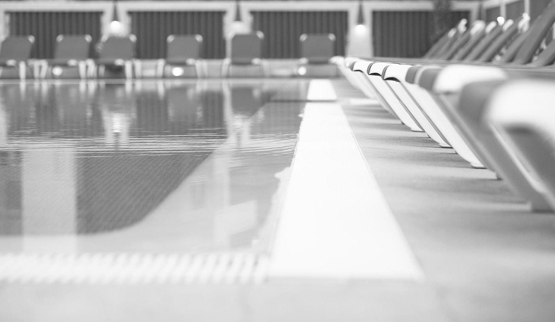 a black and white photo of a swimming pool=s1900