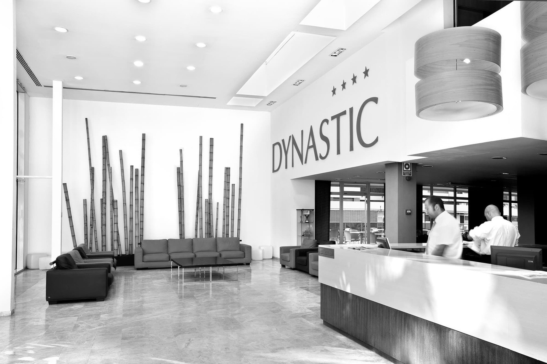 a black and white photo of the lobby of a hotel called dynastic=s1900