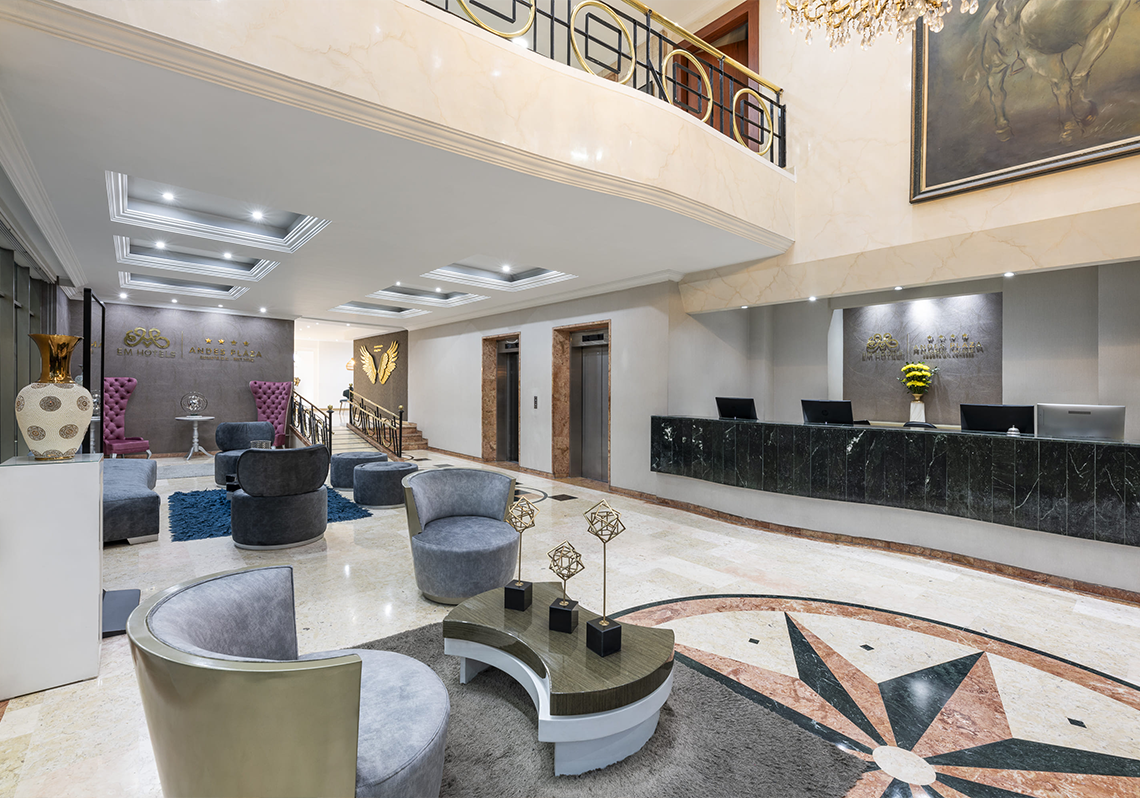 a hotel lobby with a sign that says ' hotel plaza ' on it
