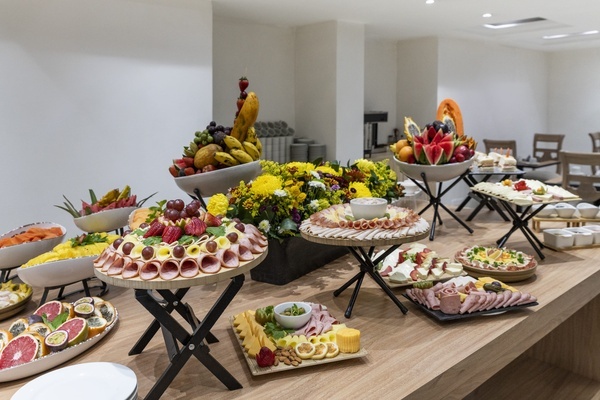 a buffet table with a variety of food on it