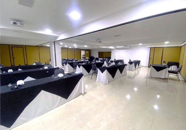 a conference room with tables and chairs set up for a meeting