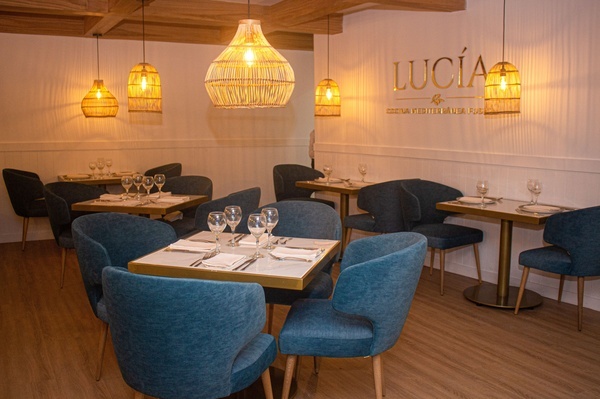 a restaurant with a sign that says lucia on it