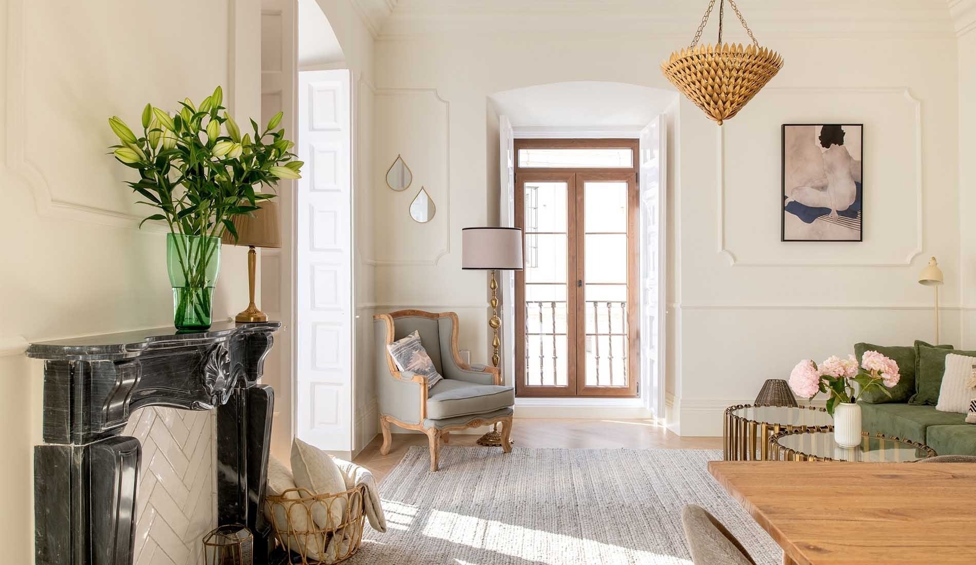 a living room with a fireplace and a chair