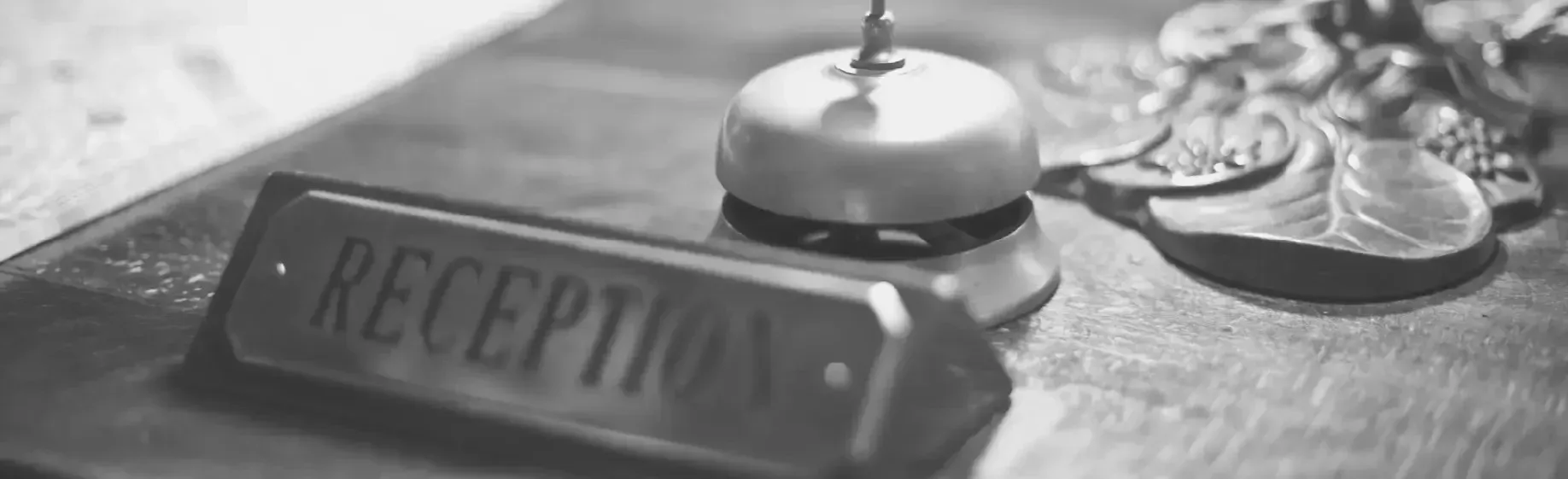 Hotel Esqina Apartments bell and sign on desk