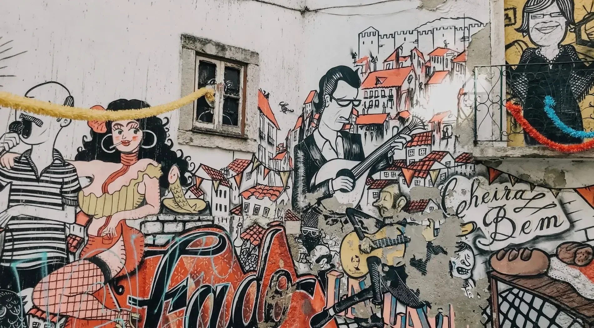 a mural on a wall shows a man playing a guitar and a woman singing