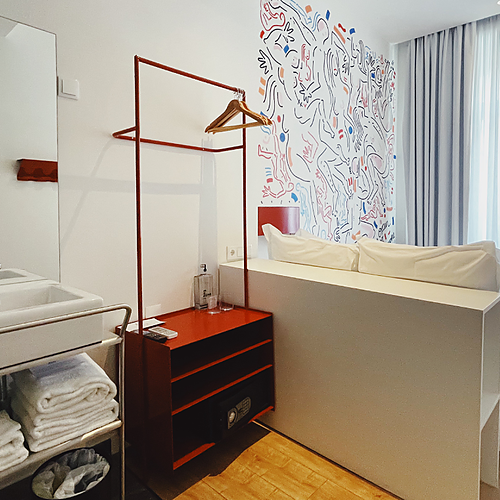 a bathroom with a sink and two bottles of hand soap