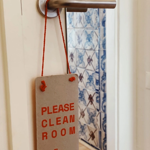 a sign on a door that says please clean room