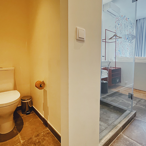 a bathroom with a toilet and a walk in shower