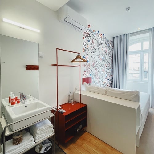 a bathroom with a sink and a bottle of coca cola