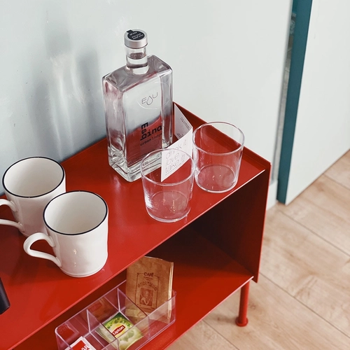 a bottle of m 5100 sits on a red shelf