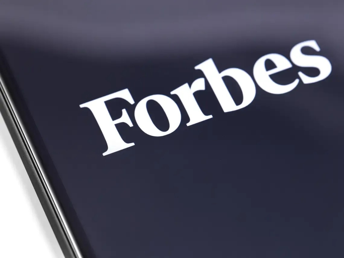 a close up of the forbes logo on a phone