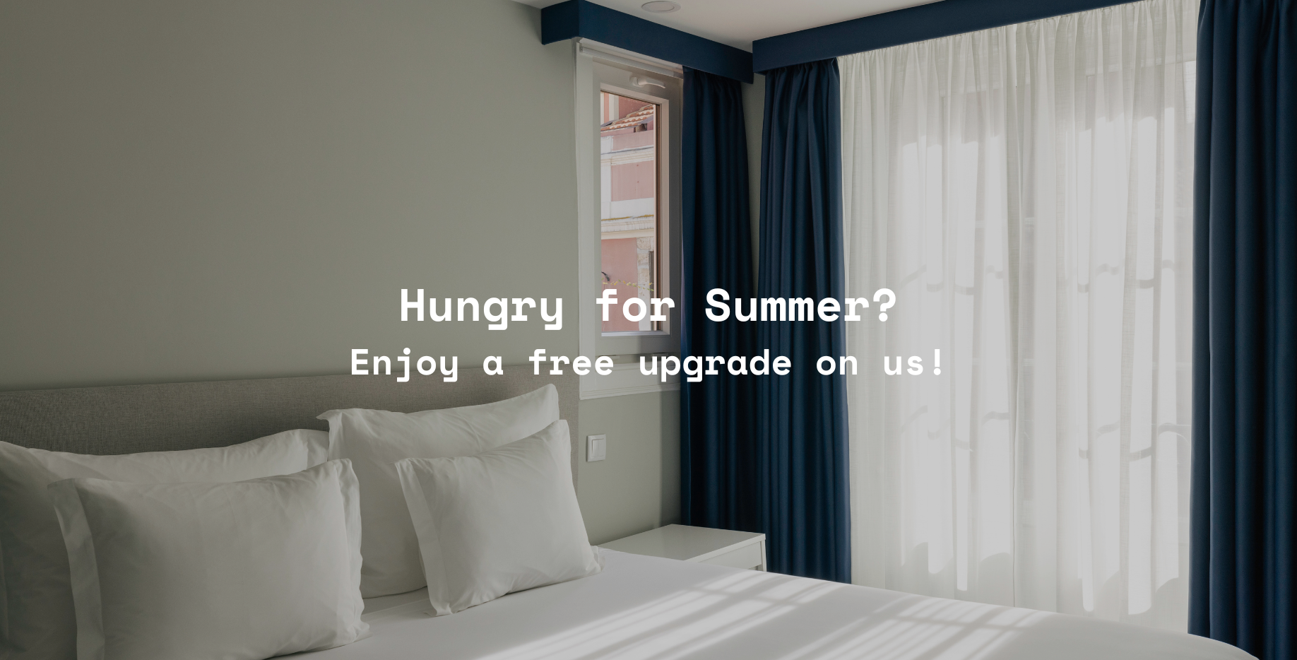 a hotel room with the words hungry for summer enjoy a free upgrade on us