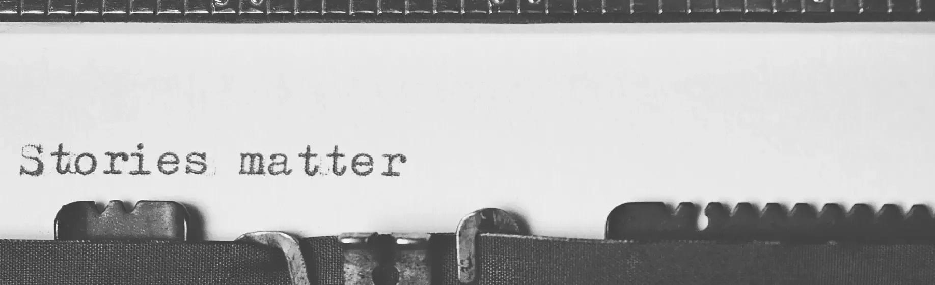 a typewriter with the words stories matter written on it