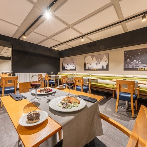 a restaurant with a sign on the wall that says relax and sleep