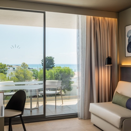 a hotel room with a view of the ocean
