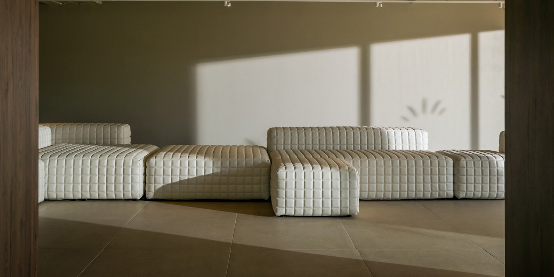 a group of people standing on a balcony overlooking the ocean
