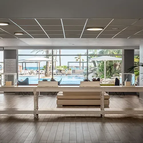 ESTIVAL: Corporativa reception area with pool and sea views.