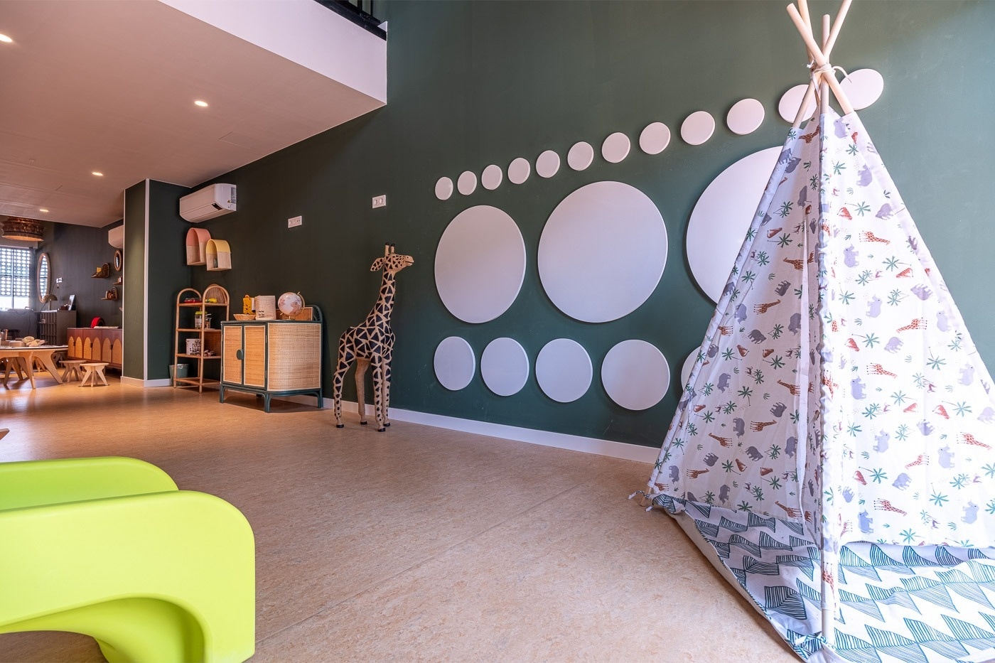 a room with a teepee and circles on the wall