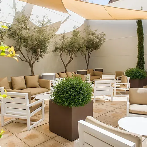 Hotel Vilamari Barcelona: Stylish outdoor lounge with sofas and chairs, perfect for relaxation.