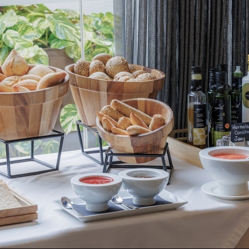 a glass of orange juice sits next to a glass of champagne