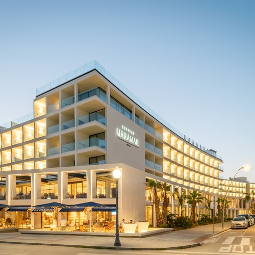 a large white building with the word manaman on it