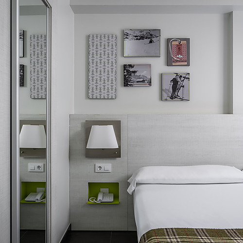 Modern living area with sofa and yellow coffee table at Hotel Cristina | Andorra | Estival Group