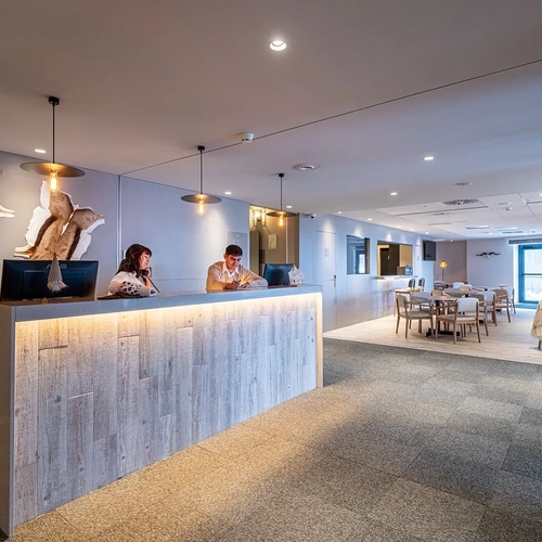 ESTIVAL: Corporate reception with hide decor and dining area.