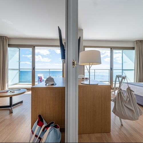 a hotel room with a view of the ocean