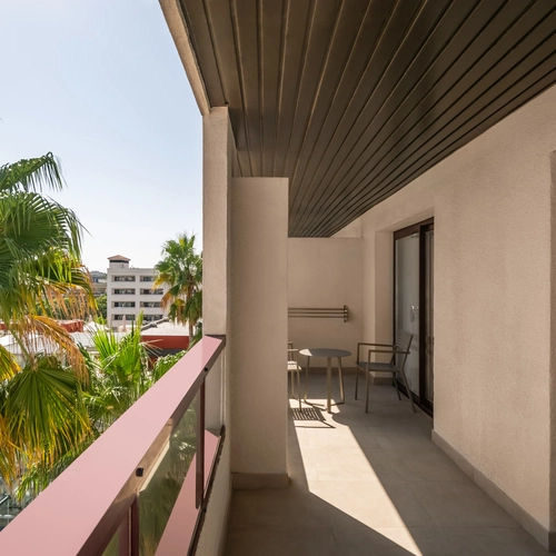 Modern hotel living room with balcony view | Estival Park Almaris
