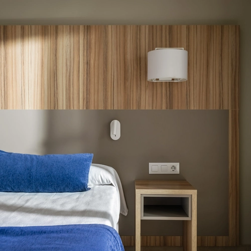 Modern hotel room with sea view balcony, queen beds, desk. Estival Park Almaris.